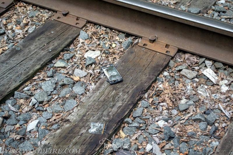 A cell phone believed to be in the home at the time of the explosion was found on the nearby train tracks