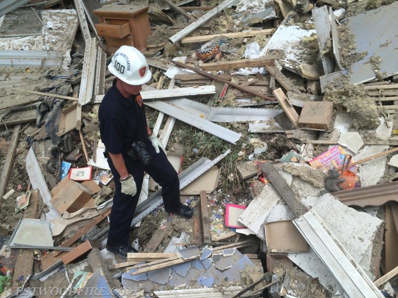 Chester County Chief Fire Marshal Weer sifts through debris for any evidence as to the cause