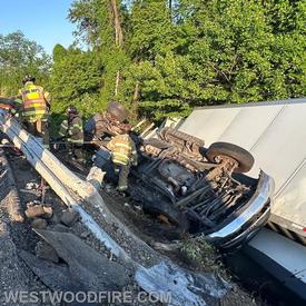 Fire and EMS crews work to stabilize the vehicles and gain access to the passenger compartments.